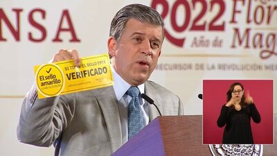 La calcomanía de color amarillo tiene la leyenda: “El sello amarillo cuida tu bolsillo” y “Si tiene está verificado”.