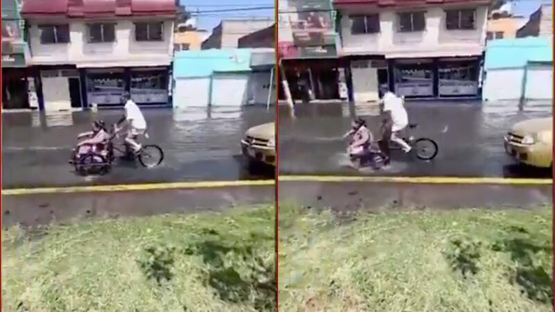 Pareja que circulaba en su triciclo cayó en un bache que estaba oculto bajo el agua